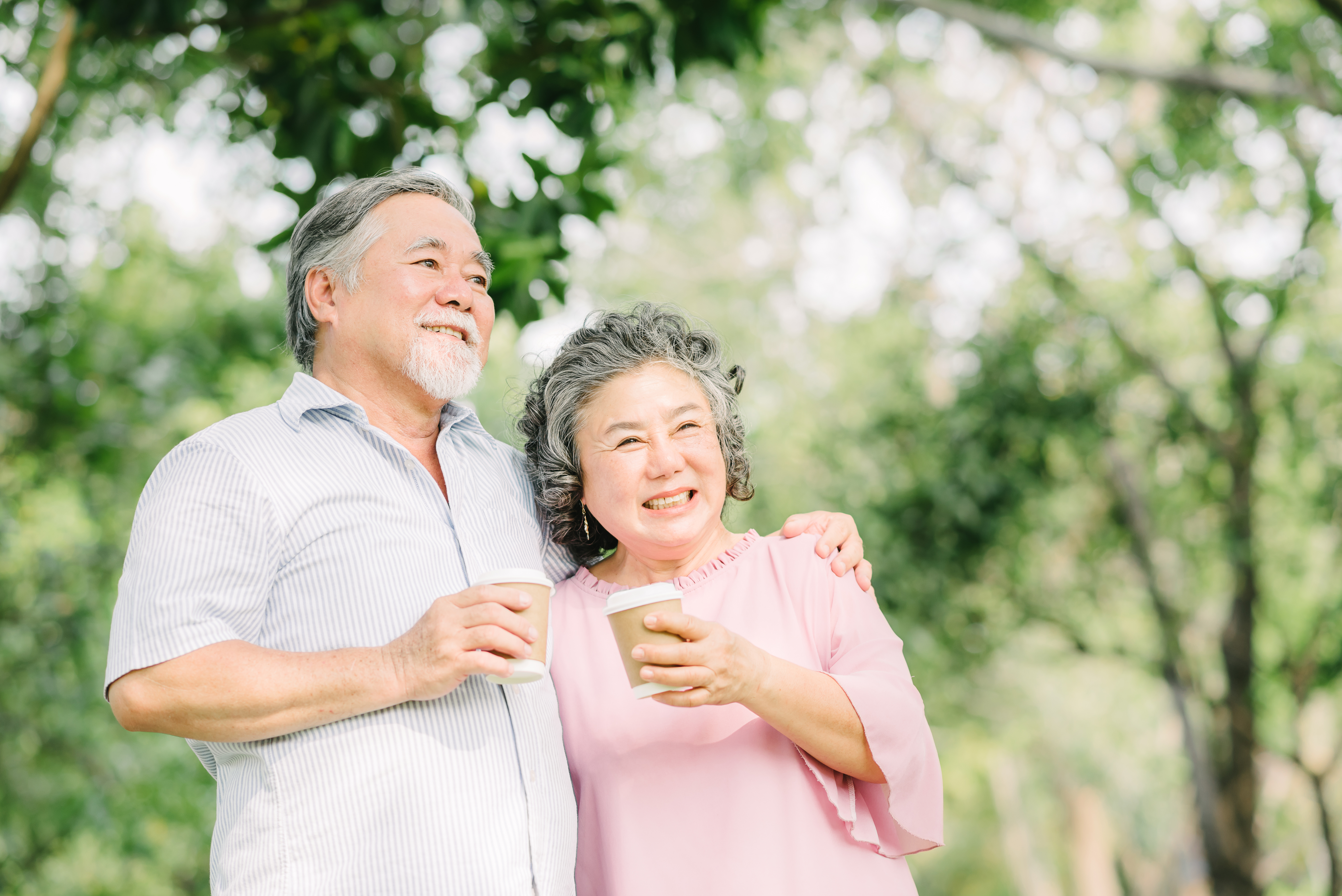 Happy elderly in a community garden